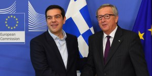 European Commission President Jean-Claude Juncker (R) shakes hands with Greek Prime Minister Alexis Tsipras at the European Commission headquarters in Brussels on February 4, 2015. Greek Prime Minister Alexis Tsipras made his first visit to Brussels since coming to power, promising to renegotiate his country's international bailout. AFP PHOTO / EMMANUEL DUNAND        (Photo credit should read EMMANUEL DUNAND/AFP/Getty Images)